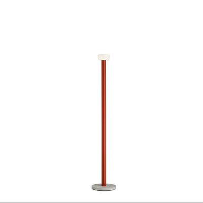 Bellhop Floor lamp by Flos featuring a sleek, modern design with a rounded shade and slim stand for stylish lighting.