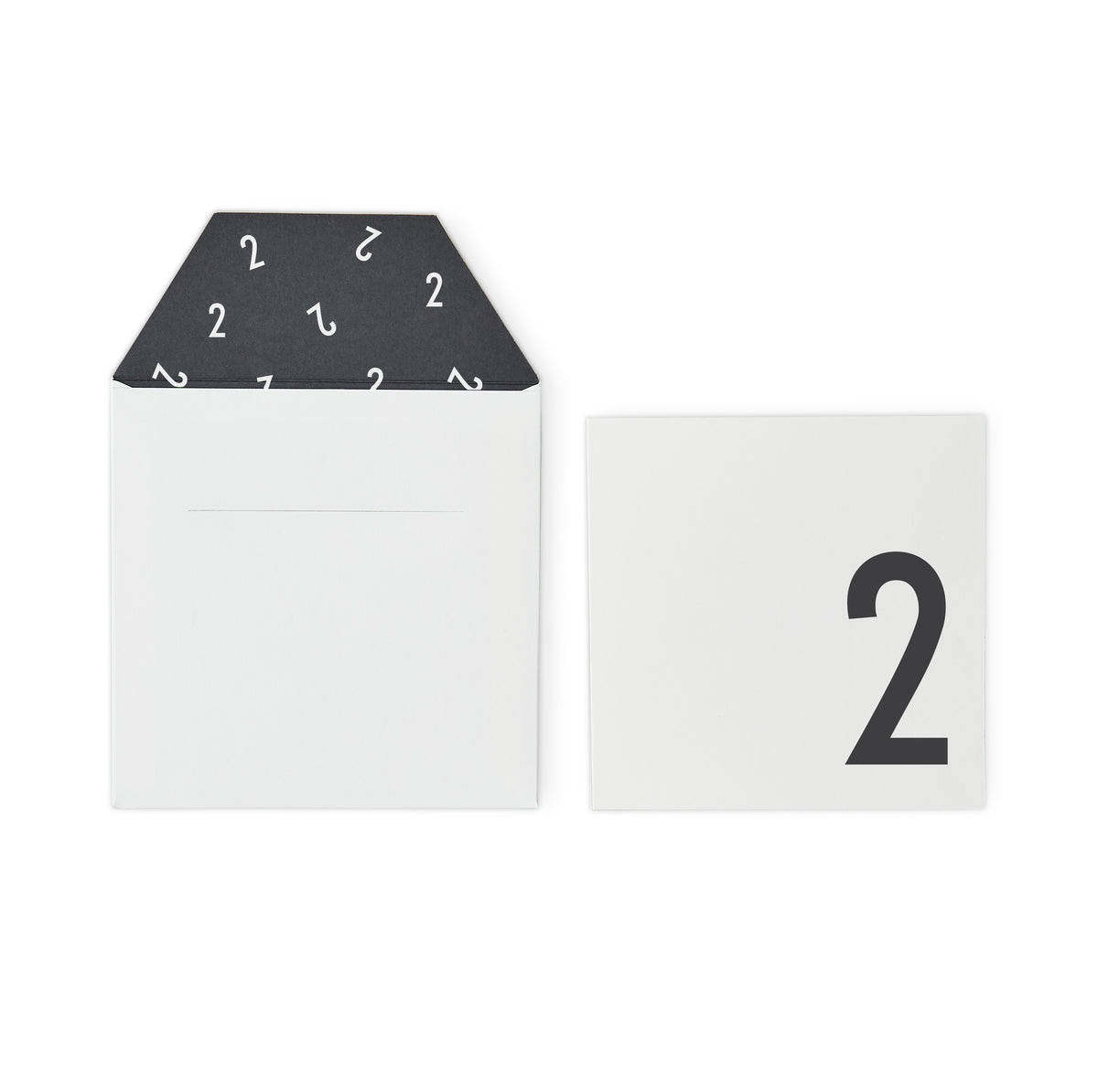 White birthday card with minimalist design and playful lettering, part of Design Letters Accessories collection.