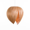Red Gladys pendant light by Atelier Cocotte featuring a white interior and large birch wood accents, modern lighting fixture.
