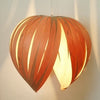 Gladys Pendant by Atelier Cocotte, large red and white birch lighting fixture with a modern design.