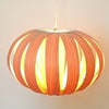 Small oak and birch white pendant light from Atelier Cocotte's Ruth collection, showcasing minimalist lighting design.