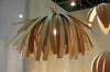 White Tina Pendant light fixture by Atelier Cocotte, featuring a sleek modern design and smooth finish, ideal for contemporary lighting.