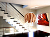 White Tina pendant light by Atelier Cocotte, showcasing its modern design and sleek pendant fixture.