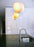 White Boules 'Mix D' pendant light by Atelier Cocotte, featuring small white glass orbs hanging from a minimalist fixture.