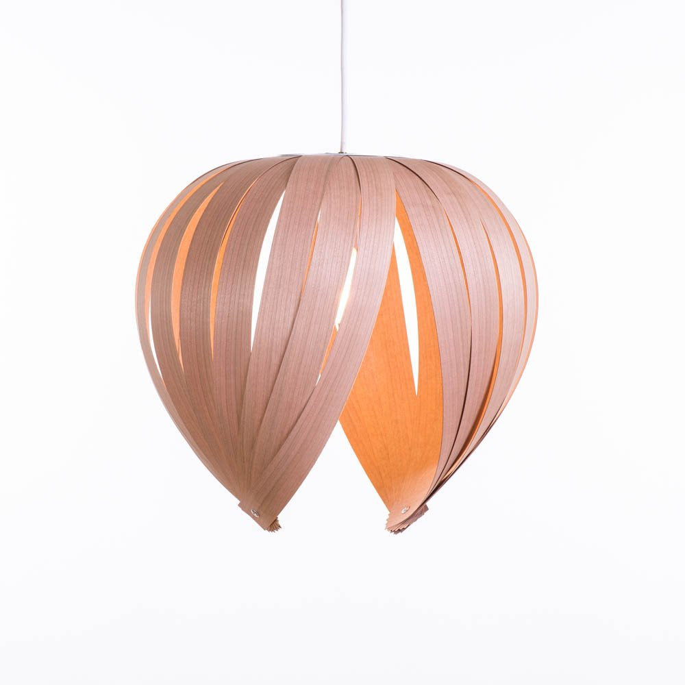 White birch Noisette #1 pendant light by Atelier Cocotte, showcasing a sleek, modern lighting fixture with smooth, rounded design.