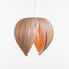 White birch Noisette #1 pendant light by Atelier Cocotte, showcasing a minimalist, modern lighting fixture with a smooth, rounded design.