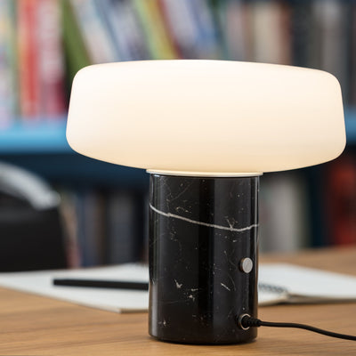 Solid marble table light by Case featuring a sleek, compact design with a white Carrara marble finish and modern lighting style.