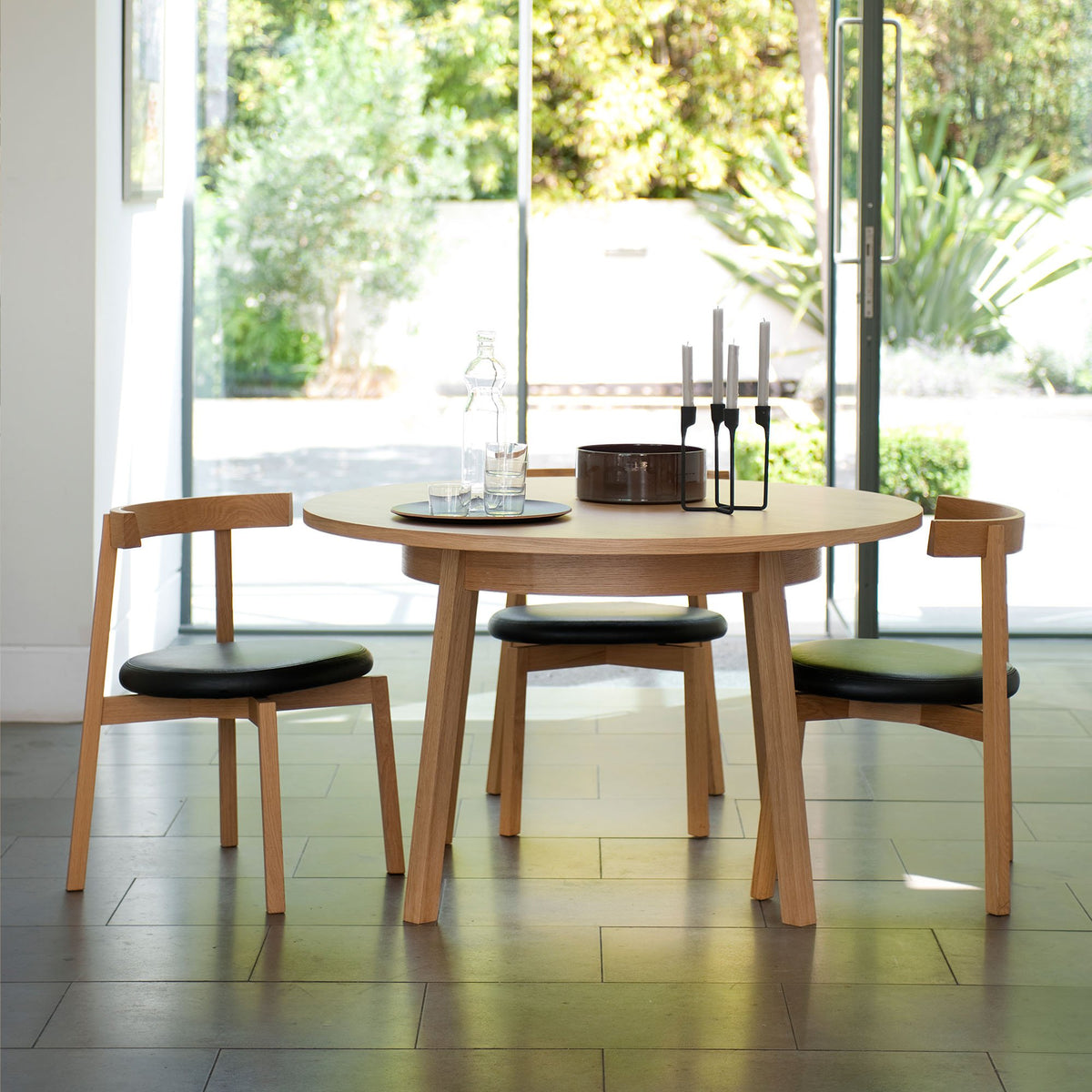 Black Oki-Nami Chair by Case, modern seating with a sleek design, featuring smooth contours and a minimalist style.