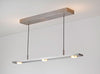 Brushed aluminum Brevis Linear LED Pendant by Cerno, USA-made lighting fixture with 2700K LED illumination and sleek modern design.