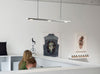 Cerno Brevis Linear LED Pendant light in brushed aluminum with 2700K glow, showcasing modern design and sleek lighting fixture.