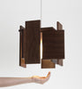 Dark stained walnut Abeo LED pendant light by Cerno, featuring warm 2700K LED illumination, made in the USA.