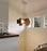 Dark stained walnut Muto Suspension Light by Cerno, USA-made modern lighting fixture with sleek design and warm 2700K glow.