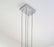 Dark stained walnut Muto Suspension Light by Cerno, modern USA-made lighting fixture with sleek design and warm 2700K glow.