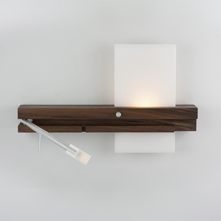 Levo wall sconce by Cerno, made in the USA, featuring sleek lighting design and a visible cord, shown mounted on a wall.