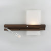 Levo wall sconce by Cerno, made in the USA, featuring sleek lighting design and a visible cord, shown mounted on a wall.