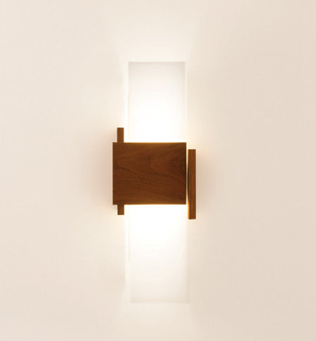 Cerno Acuo wall sconce in oiled walnut wood with LED lighting, made in the USA, designed for modern interior lighting.
