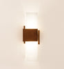 Cerno Acuo wall sconce in oiled walnut wood with LED lighting, made in the USA, designed for modern interior lighting.
