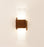 Cerno Acuo wall sconce in oiled walnut wood with LED lighting, made in the USA, designed for modern interior lighting.
