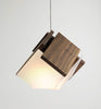 Cerno Mica LED pendant light in oiled walnut wood, showcasing modern lighting design with warm 2700K LED illumination.