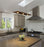 Cerno Vix Linear LED Pendant in dark stained walnut with 2700K warm light, showcasing sleek modern lighting design.
