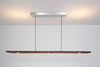 Cerno Vix Linear LED Pendant in dark stained walnut with warm 2700K light, modern lighting fixture made in the USA