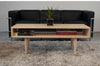 Walnut classic coffee table by Eastvold Furniture with nine legs, showcasing a sleek, modern design and smooth wooden finish.