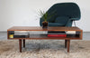 Walnut classic coffee table by Eastvold Furniture featuring nine legs and a sleek, modern design.