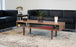 Walnut classic coffee table with nine legs by Eastvold Furniture, showcasing a sleek, modern design and smooth wood finish.