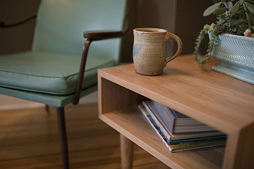 Walnut Classic Side Table by Eastvold Furniture with 12-legs, showcasing sleek design and craftsmanship.
