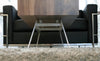 Walnut Elko Coffee Table by Eastvold Furniture featuring a sleek, modern design with clean lines and a smooth surface.