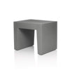 White concrete seat by Fatboy, modern outdoor seating with smooth concrete finish and sleek design.