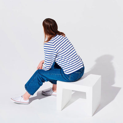 White concrete Fatboy seating seat, modern outdoor furniture piece with smooth surface and sturdy design.
