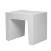 White concrete seat by Fatboy, modern outdoor seating with a smooth, rounded design and sturdy construction.