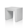 White concrete seating by Fatboy, modern outdoor bench with a sleek, minimalist design for stylish outdoor spaces.