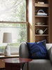 Black Orb Watering Can by Ferm Living, a stylish accessory with a rounded design for watering plants.