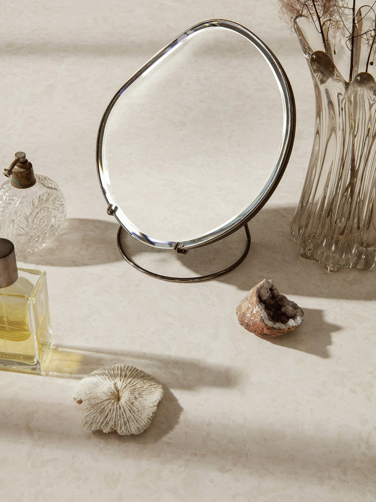 Ferm Living Brass Pond Table Mirror in accessories collection, featuring a round brass frame and reflective surface.