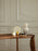Brass Pond Table Mirror by Ferm Living, a stylish accessories piece with a round reflective surface and a brass frame.