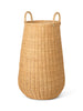 Ferm Living braided laundry basket made of woven fibers, stylish storage accessory for laundry or organization.