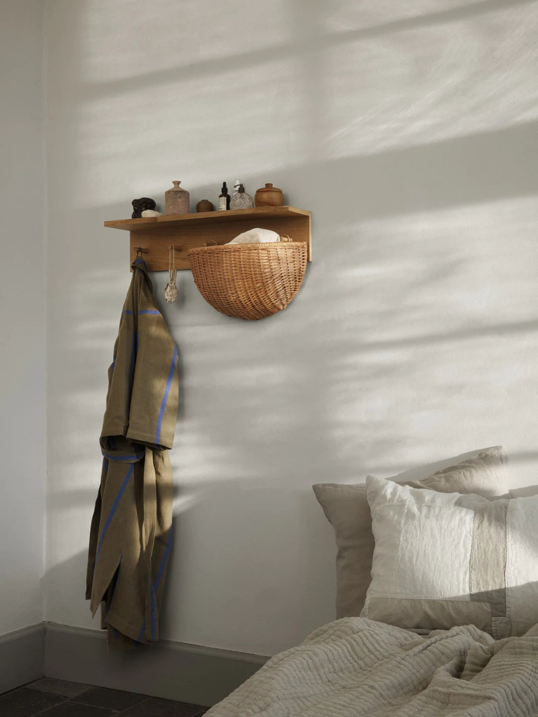 Set of two braided wall pockets by Ferm Living, handmade accessories with woven texture for stylish storage and decor.