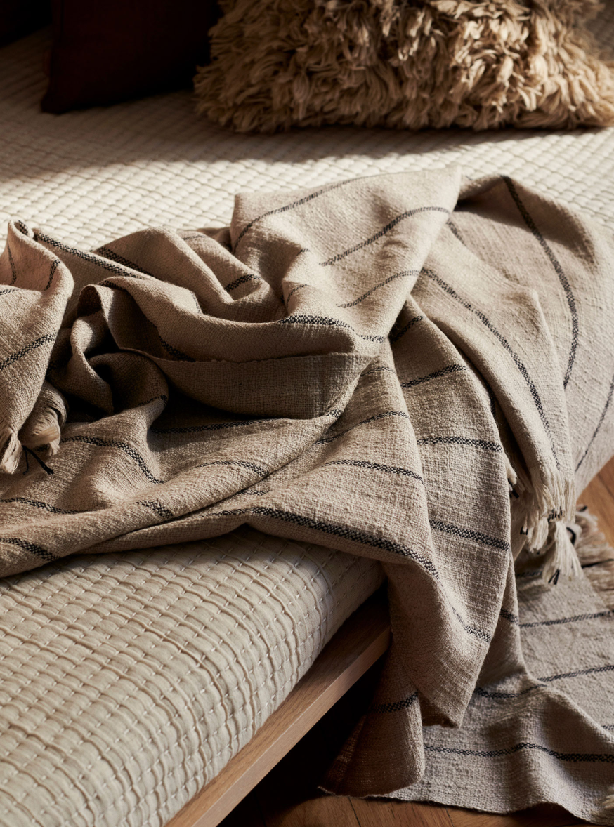 Ferm Living Calm Blanket, soft and cozy accessories in neutral tones, perfect for relaxing and adding comfort to a living space.