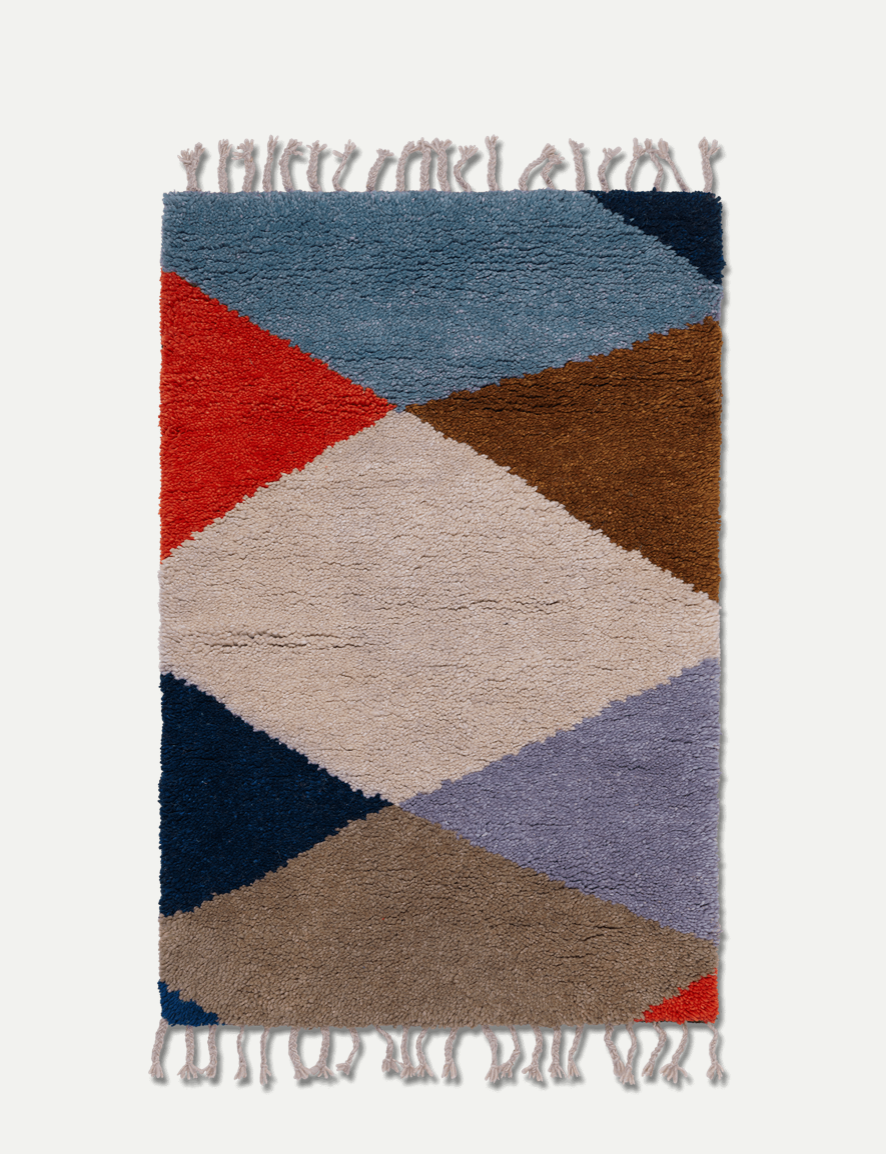 Harlequin Knotted Rug by Ferm Living, featuring a colorful geometric pattern, crafted as a stylish home accessory.