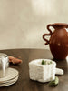 Ferm Living Petra Mortar, a stylish gray ceramic accessories piece with a textured surface, ideal for kitchen or decor use.
