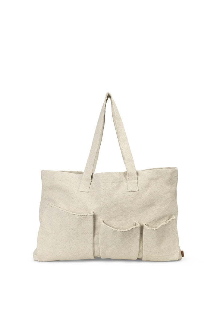 Ferm Living Pocket Weekend Bag in durable fabric with leather accents, designed for stylish travel and accessories.