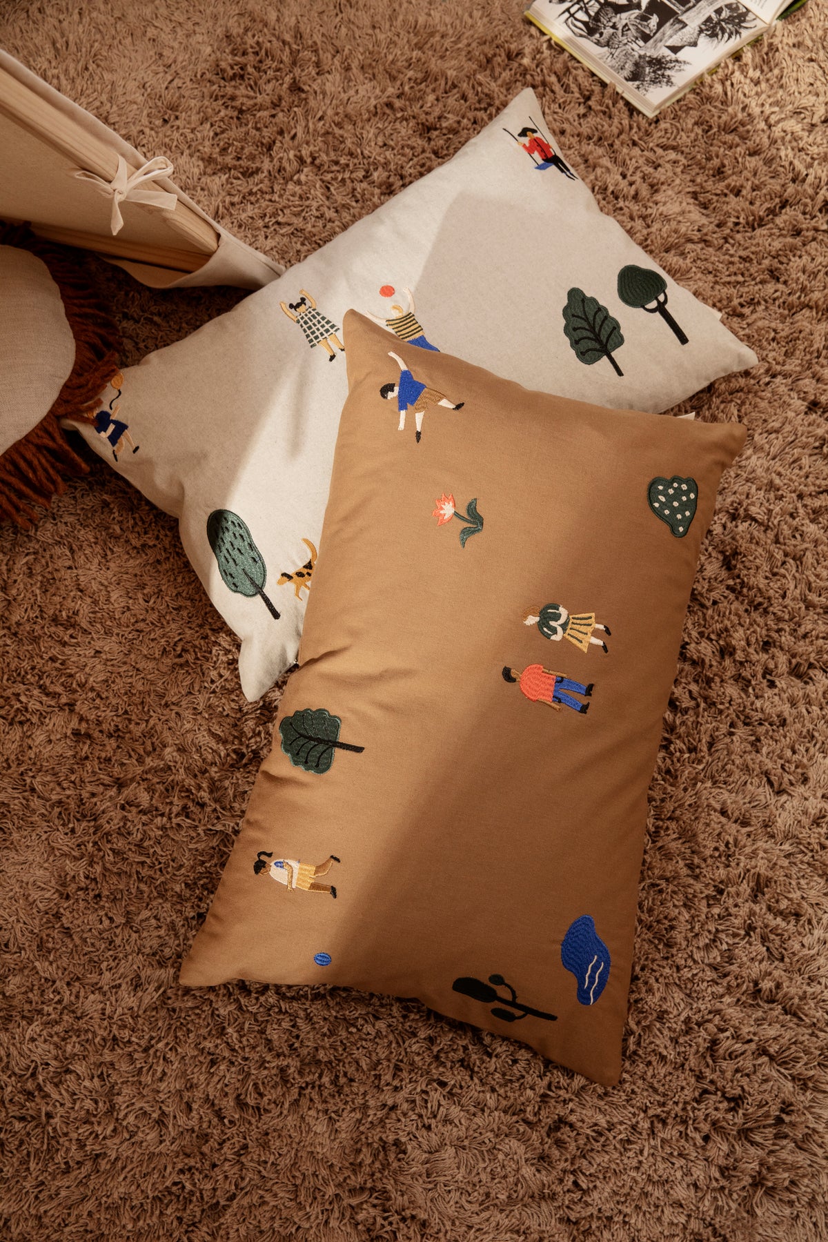 Natural-colored The Park Cushion by Ferm Living, soft textile accessory with subtle pattern and plush texture for home decor.