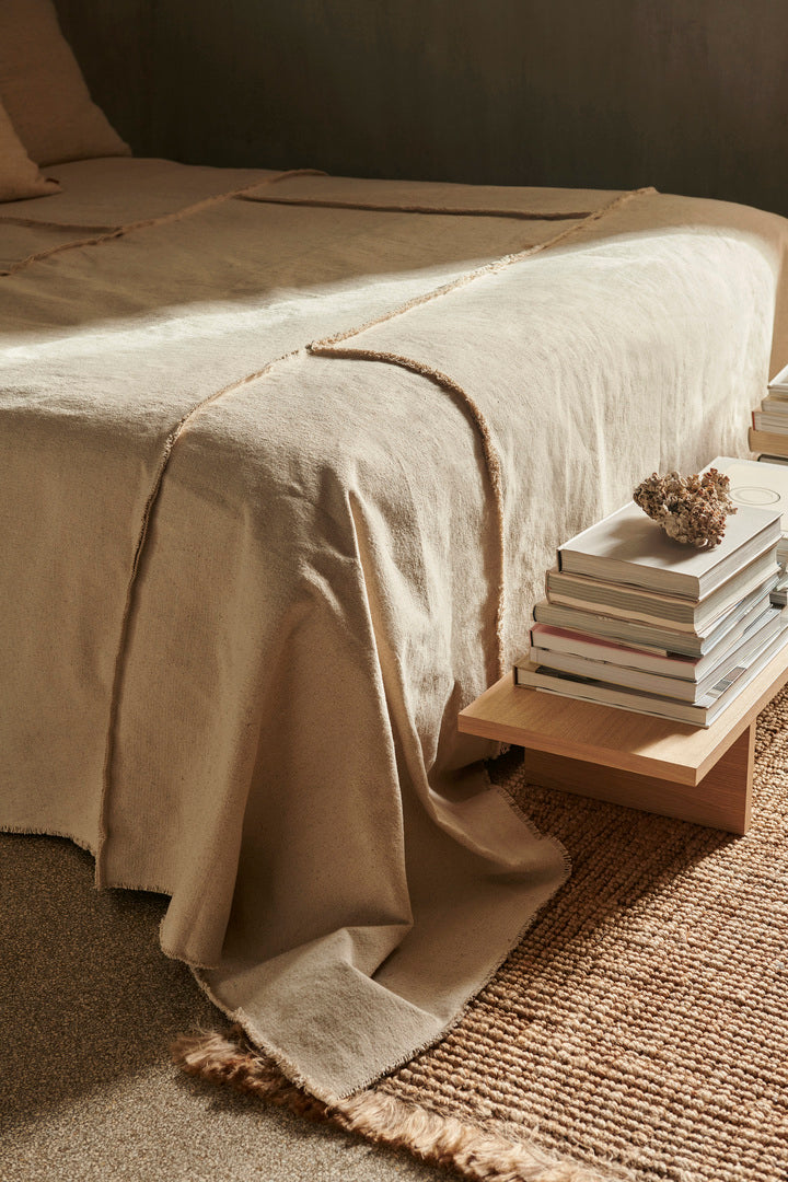 Ferm Living Offset Bedspread in a modern bedroom setting, showcasing stylish, textured bedding with geometric patterns.
