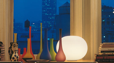 Flos Glo-Ball Basic table lamp with rounded white glass shade and sleek metal base, modern lighting by Flos.