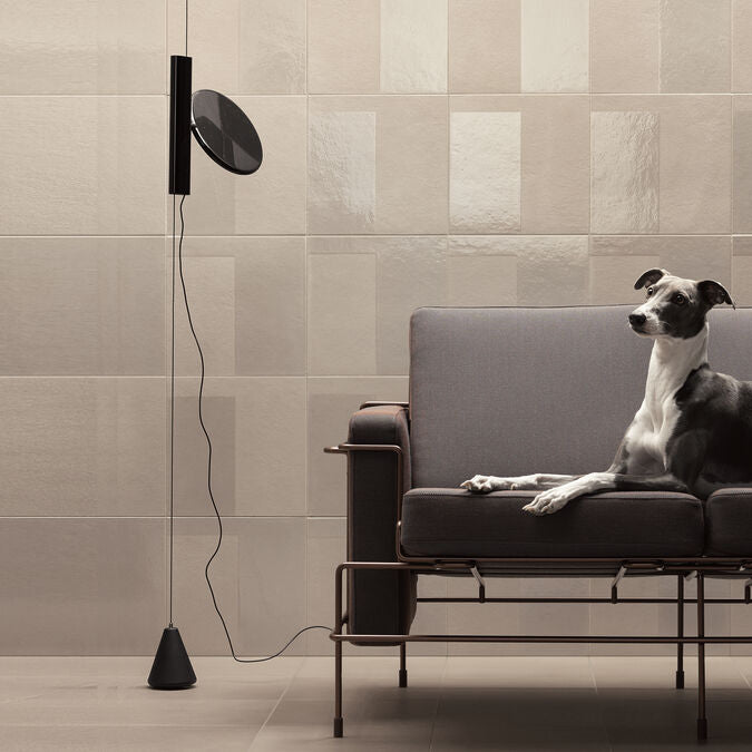 Black OK by Flos suspension lamp, modern lighting fixture with sleek design, hanging from ceiling, featuring a minimalist style.