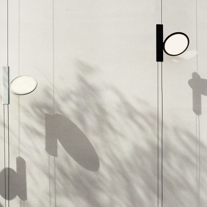Black OK by Flos suspension lamp, modern lighting fixture with sleek design and adjustable suspension cables.