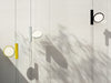 Black OK Suspension Lamp by Flos hanging from ceiling with a sleek, minimalist design for modern lighting.