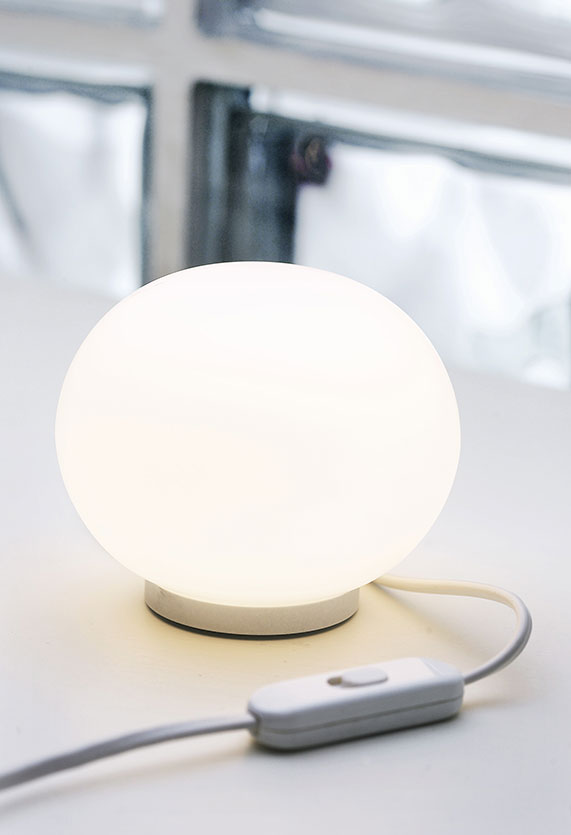Mini Glo-Ball table lamp by Flos, modern lighting fixture with a spherical glass shade, perfect for stylish interior illumination.